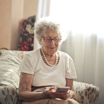 elderly woman using smartphone